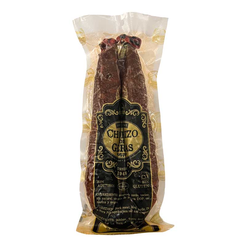 A vacuum-sealed package of Entrepenas Chorizo de Leon in a U shape with a distinct black and gold label on a plain white background.