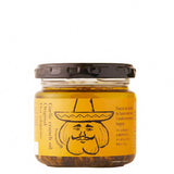 A 110g glass jar of Odawaraya garlic crunch oil with jalapenos with a black screw-on lid and an orange label featuring a cartoon illustration of a bearded man in a sombrero.