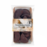 A package of Paiarrope 'Naranja Bañada en Chocolate' - Chocolate dipped candied orange slices - in a clear plastic bag with a beige paper label, set against a plain white background.
