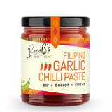 A jar of RoniB's Kitchen Filipino Garlic Chilli Paste, featuring a cream-colored label with orange and red text, a black lid, and a black-and-orange plastic seal, set against a plain white background.