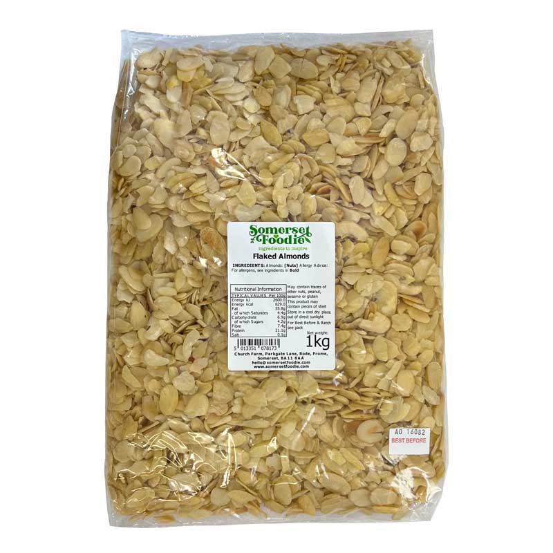A 1kg bag of Somerset Foodie Flaked Almonds in clear packaging with a label on a white background