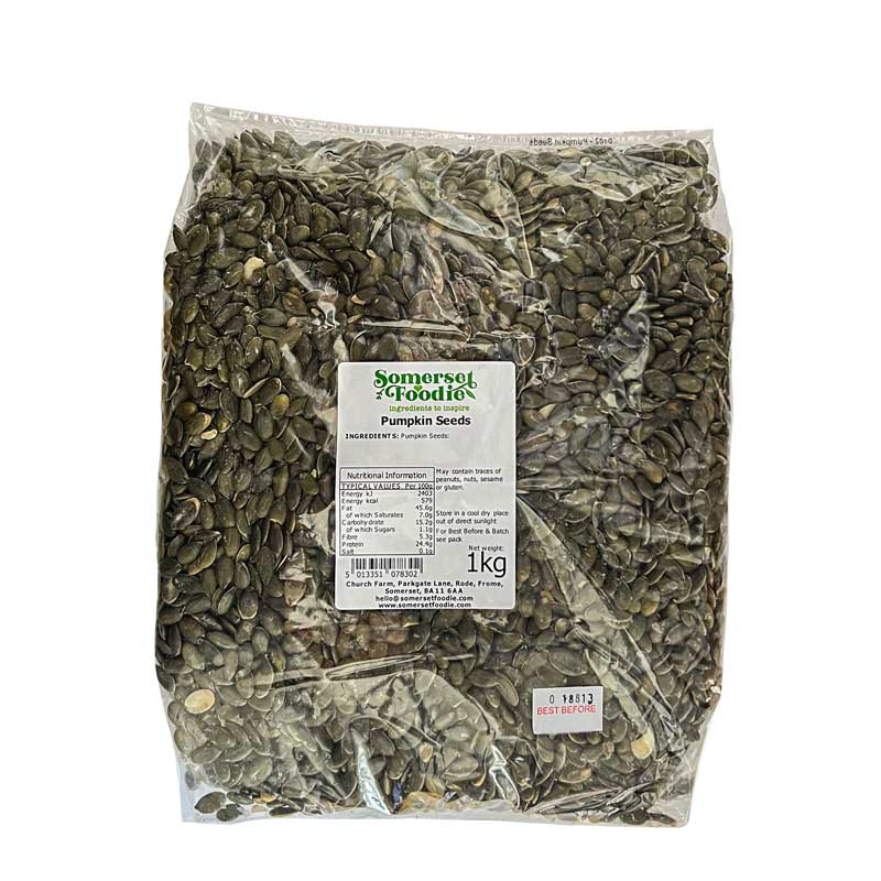 A clear 1kg bag of pumpkin seeds with a Somerset Foodie label on a white background