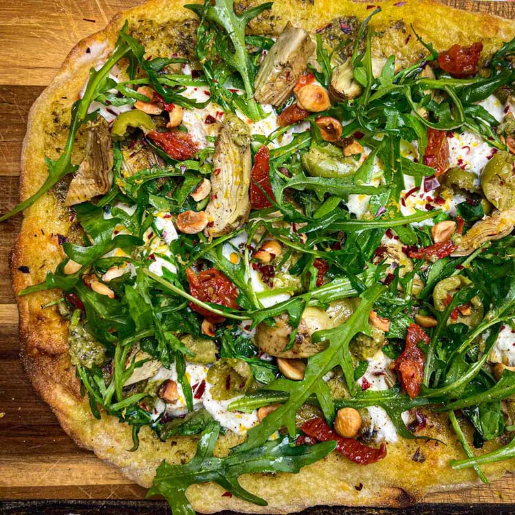 Pinsa Romana with Artichokes, Burrata Cheese & Toasted Hazelnuts