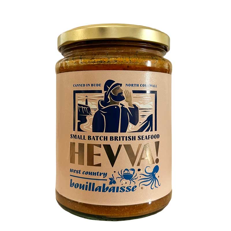 A 470g glass jar of 'HEVVA! West country bouillabaisse' jarred British seafood, featuring a beige label with a navy blue illustration of a fisherman and a gold metal lid, set against a plain white background.