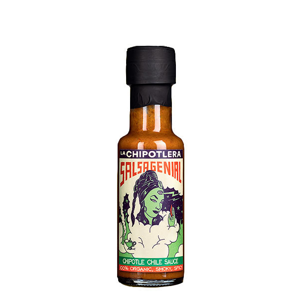 A 125ml bottle of La Chipotlera Salsa Genial with a surreal and vibrant illustration of lady with a green face on the label. 