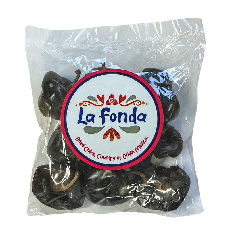 A 100g bag of La Fonda Dried Cascabel Chillies in a clear bag that shows the round dried chillies.