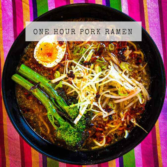 A steaming bowl of ramen with noodles and toppings