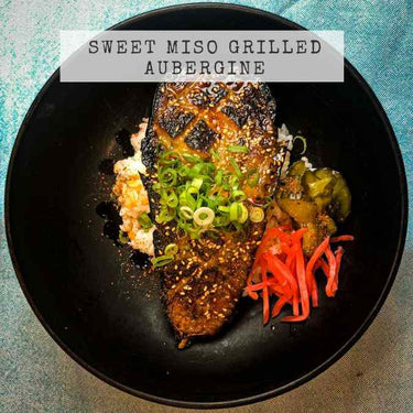 Recipe showing a Japanese Sweet Miso Marinated Aubergine with pickled ginger in a black bowl