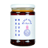 A 240g jar of White Mausu Black Bean Rayu with a white label with blue writing on a white background